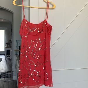 Malcolm & Co. coral dress with sequin.